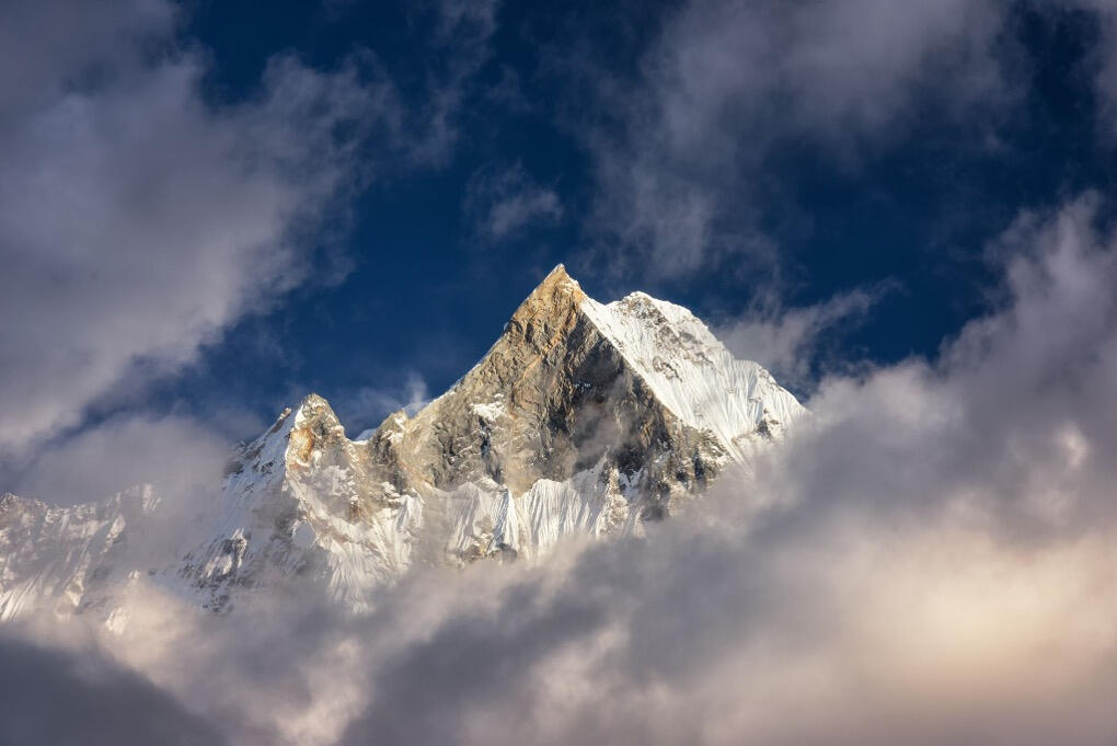 Belong Capital | Rocky Mountain Peak Belong Capital | Rocky Mountain Peak with blue sky and clouds